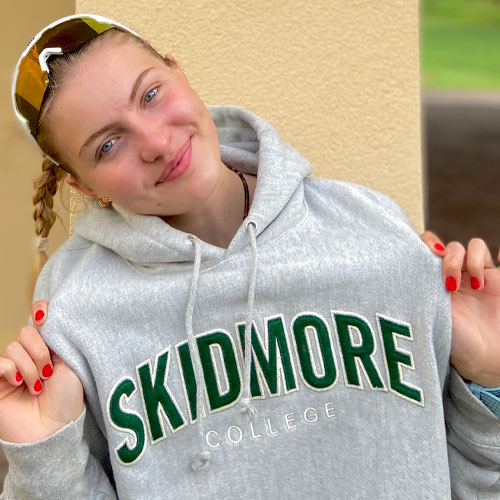 Rowing student Maddie celebrating success with crew team at Skidmore College in New York