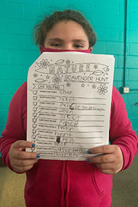 Student and her recordings from her nature scavenger hunt